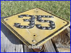 Embossed road, highway speed sign. Glass marble reflectors. Pre-war date stamp
